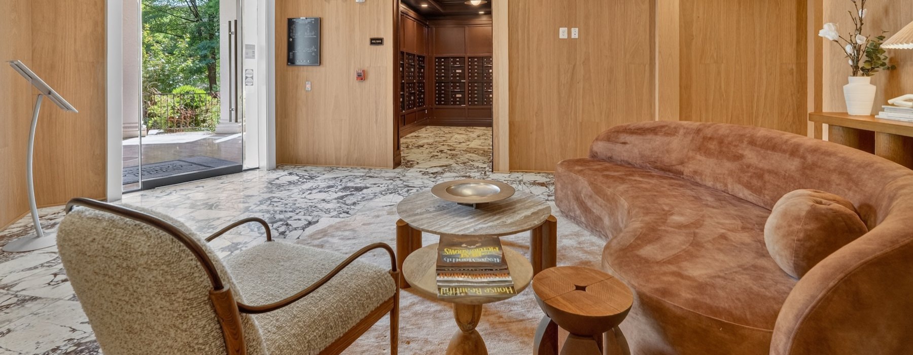 a lounge with a couch and a chair