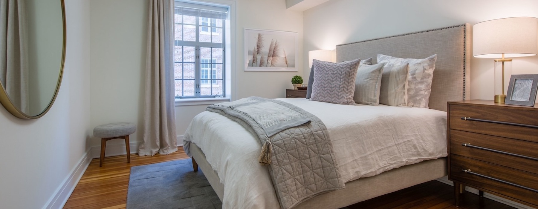 a bedroom with a bed and two nightstands