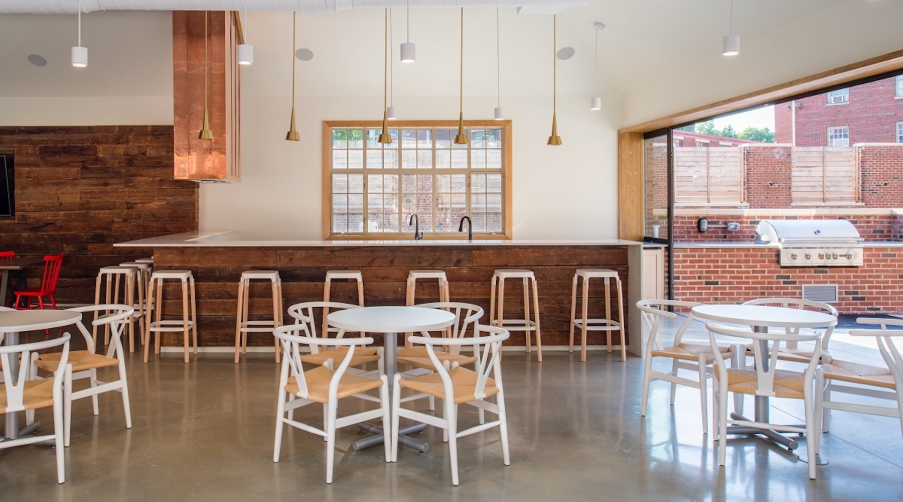 a clubroom with tables and chairs