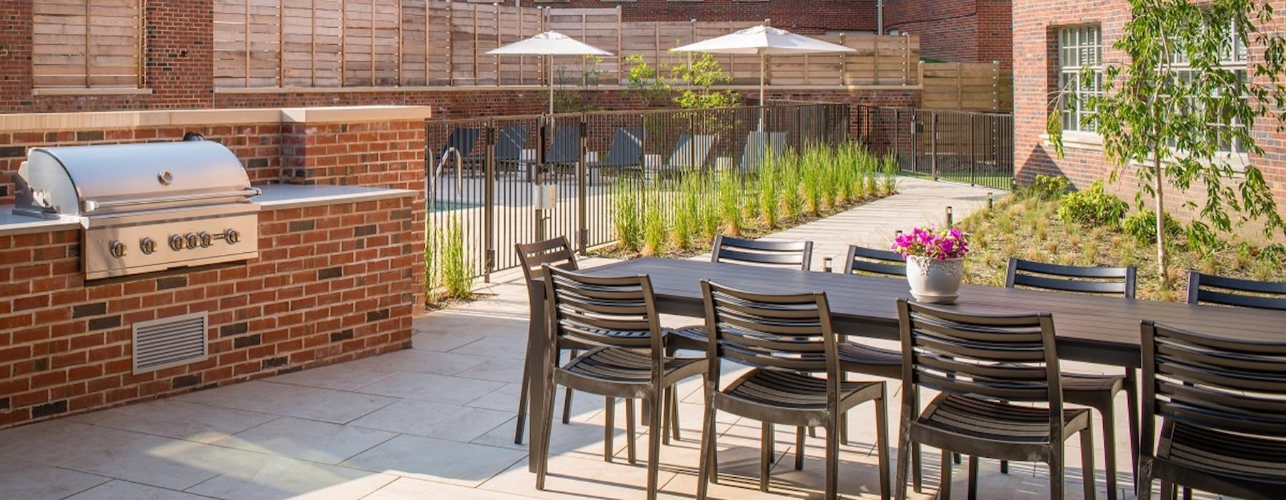 a patio with chairs and tables