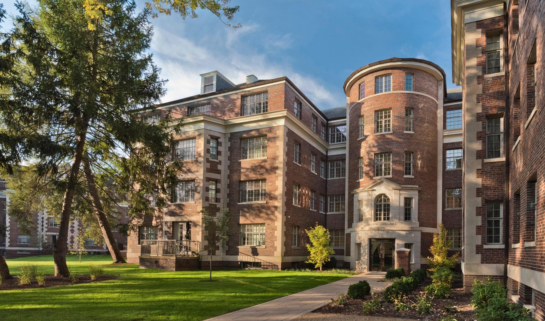 a building with a lawn and trees