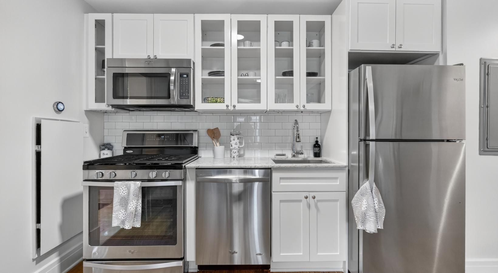 a kitchen with white cabinets