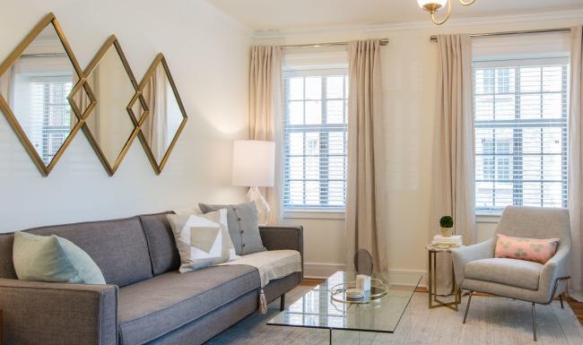 a living room with a couch and a table